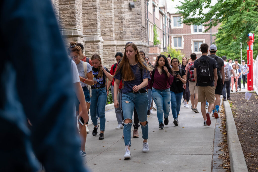 People walking nearby University Hall