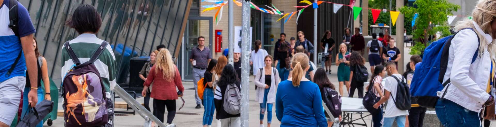 Courtyard area in front of the McMaster Student Centre with people walking nearby